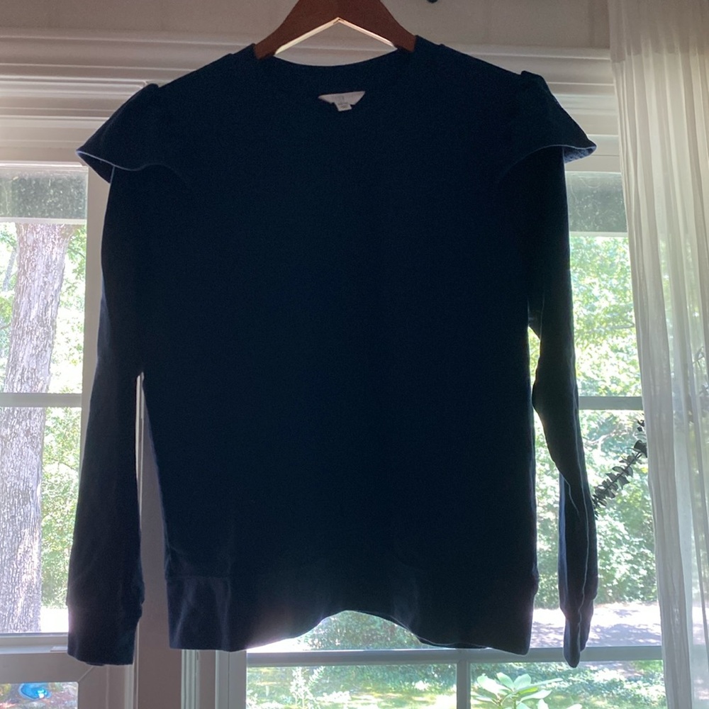 Brand new sweater top with ruffles